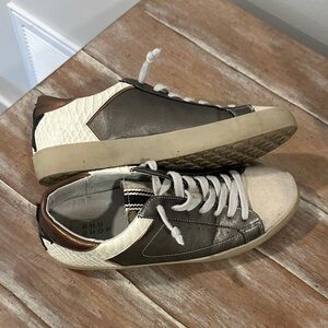 Shu Shop Stylish Black and White Sneakers with Bronze Accents